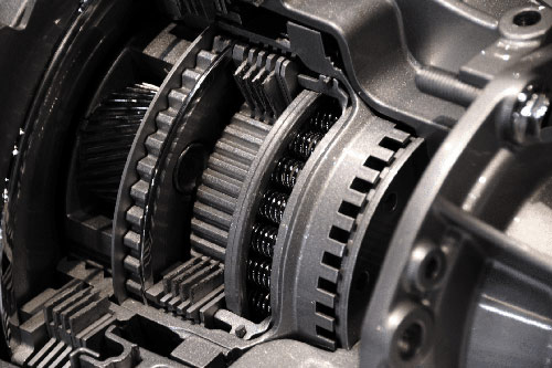 Technician rebuilding a transmission at Tri-County Transmissions