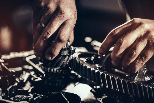 Transmission repair being performed on a vehicle